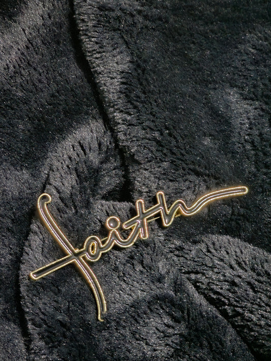 Strong gold metal mixed with black to grave word faith